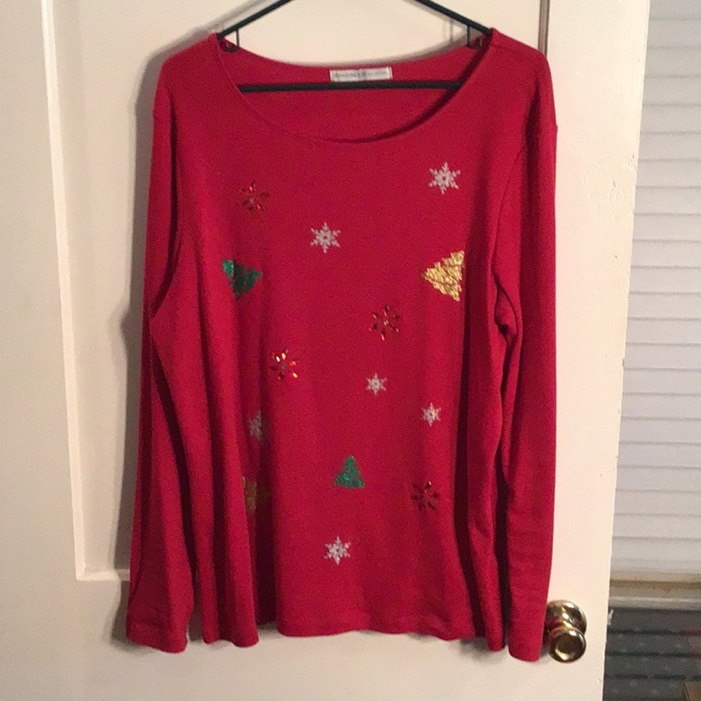 Red Christmas sweater with front details.